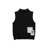 DAMAGE SLEEVELESS TURTLE NECK KNIT TOP IN BLACK