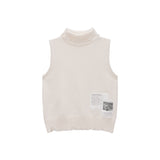 DAMAGE SLEEVELESS TURTLE NECK KNIT TOP IN IVORY