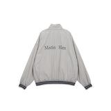 REVERSIBLE COATING TRACK JUMPER IN GREY